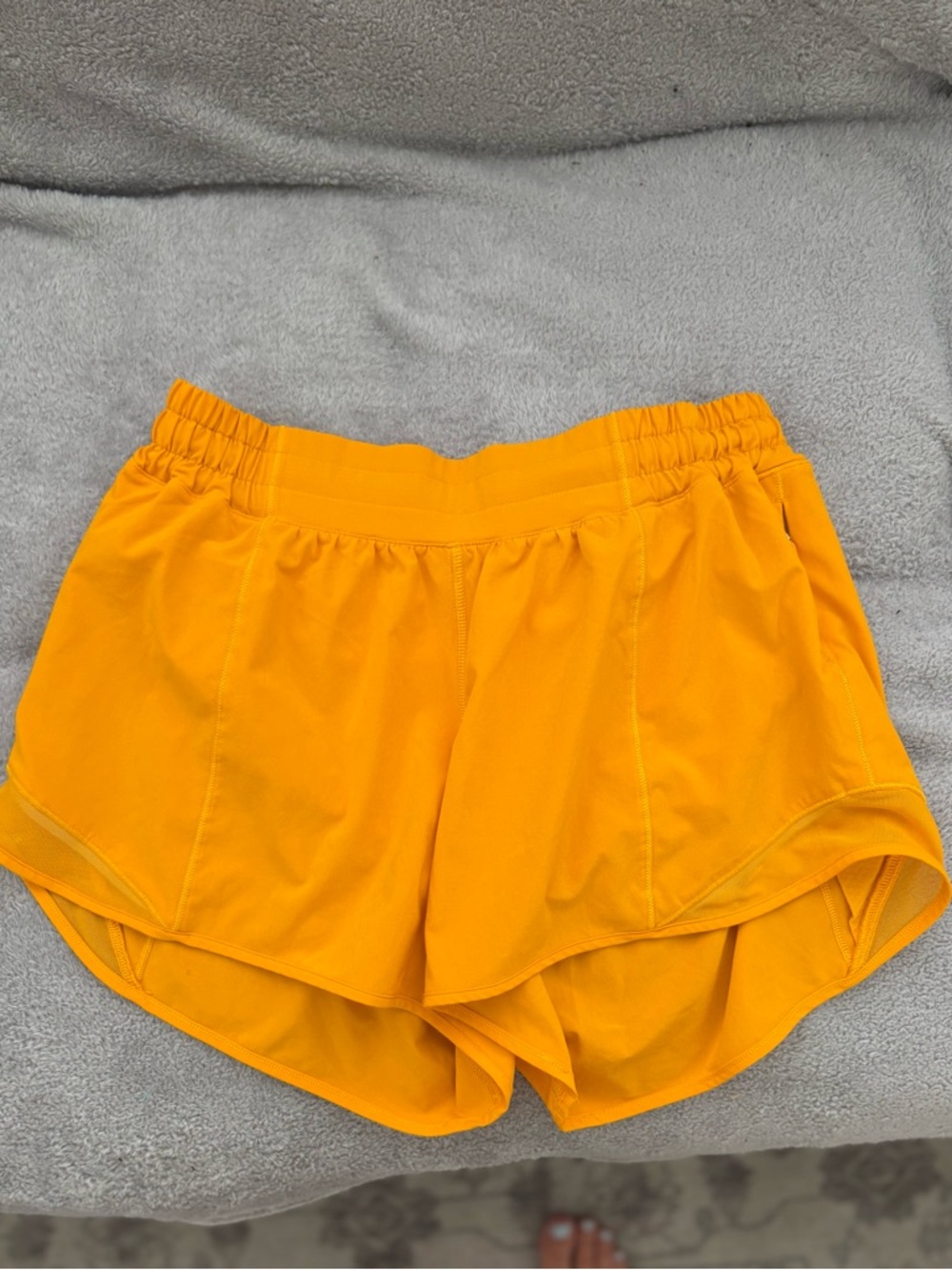 Lululemon Hotty Hot Low Rise Short 4” with liner Size 8 Clementine Orange
